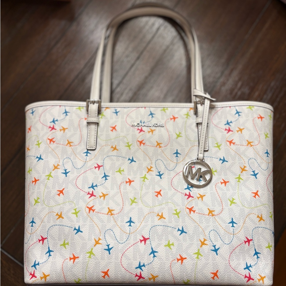 Michael Kors Cream Tote with Colorful Airplane Design
